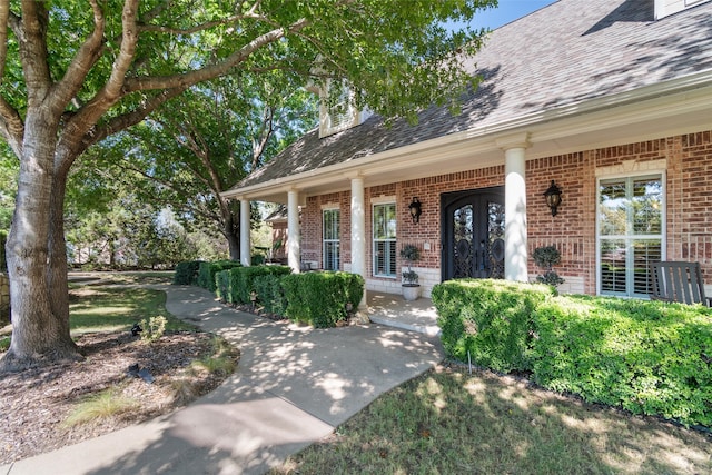 entrance to property featuring covered porch