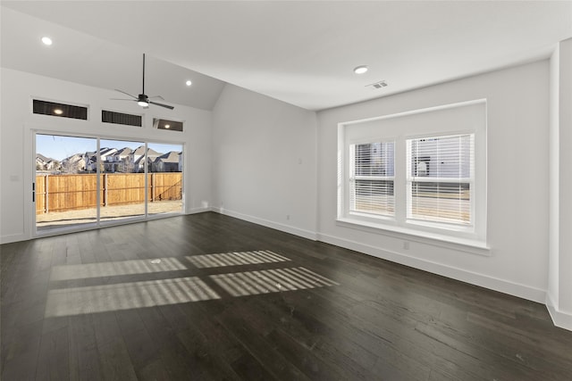 unfurnished room with ceiling fan, dark hardwood / wood-style floors, and vaulted ceiling