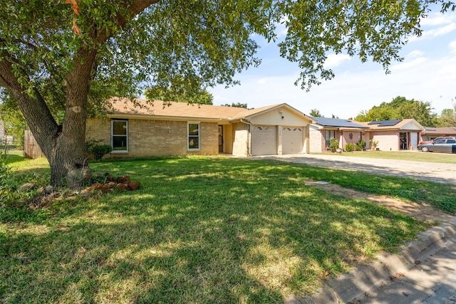 single story home featuring a garage and a front lawn