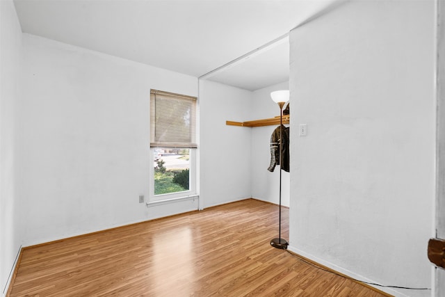 spare room featuring light hardwood / wood-style flooring