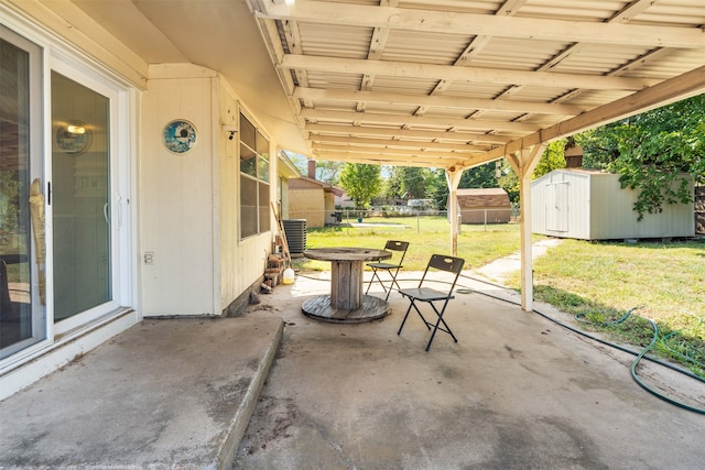 view of patio / terrace with a shed