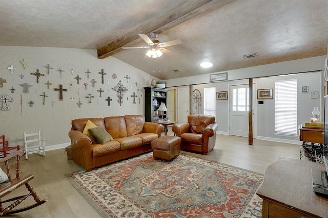 living room with vaulted ceiling with beams, hardwood / wood-style floors, and ceiling fan