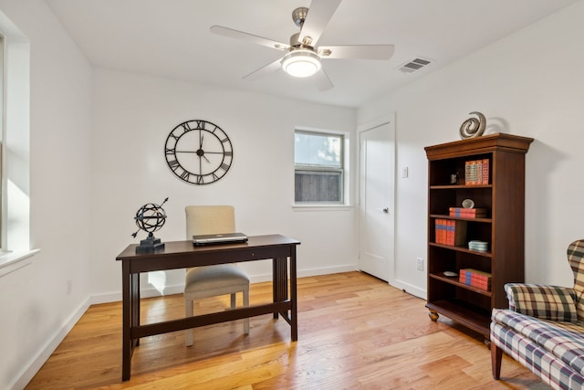 office featuring light wood-type flooring and ceiling fan