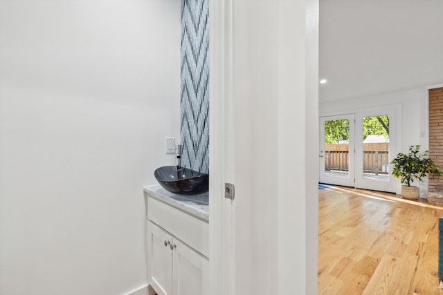 bathroom featuring vanity and hardwood / wood-style flooring