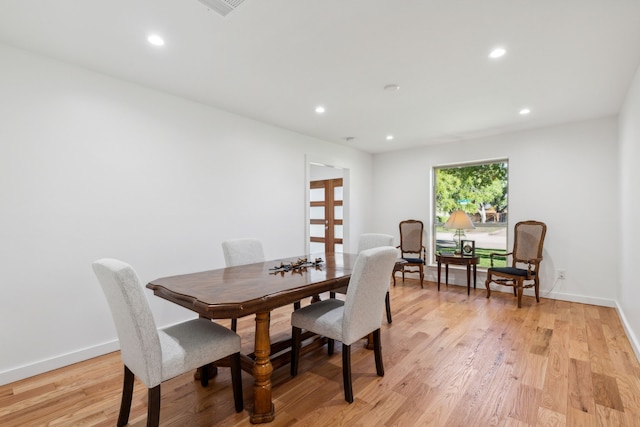 dining room with light hardwood / wood-style floors