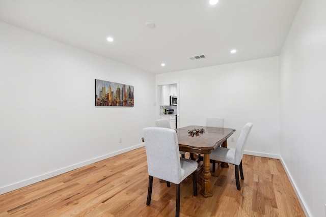 dining room with light hardwood / wood-style flooring