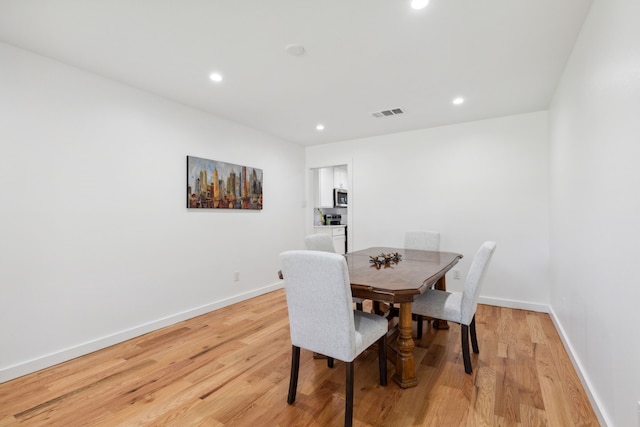 10606 Royalwood Dr, Dallas, TX 75238 - dining room featuring light wood-style floors, recessed lighting, and baseboards