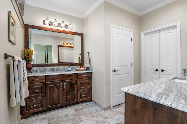 bathroom with vanity and ornamental molding