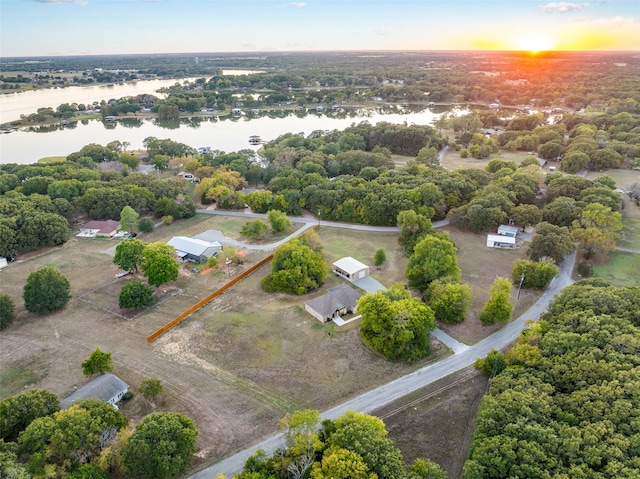 aerial view at dusk with a water view