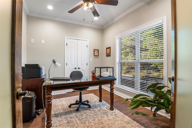 office space with crown molding, ceiling fan, and wood-type flooring