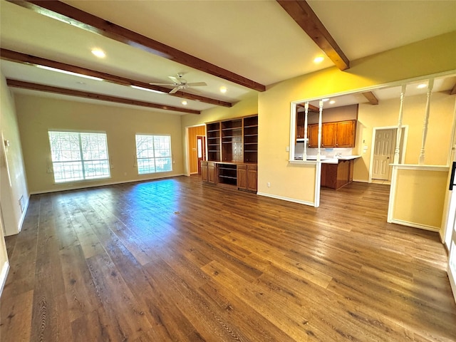 unfurnished living room with a ceiling fan, dark wood-style flooring, beam ceiling, and recessed lighting