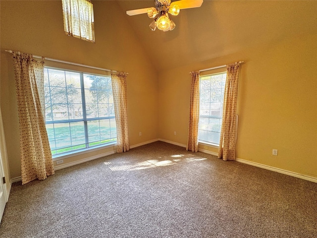 empty room featuring baseboards, carpet floors, high vaulted ceiling, and ceiling fan