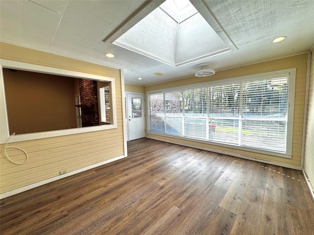 empty room with recessed lighting and wood-type flooring