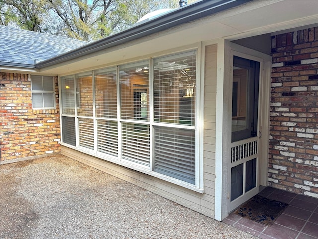 property entrance with brick siding