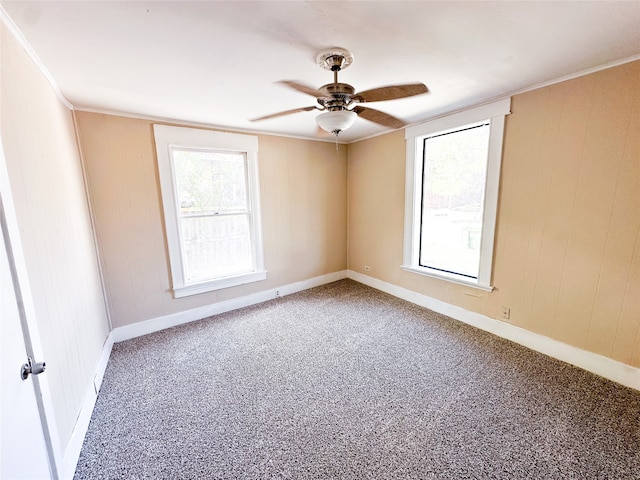 unfurnished room featuring carpet floors, crown molding, and ceiling fan