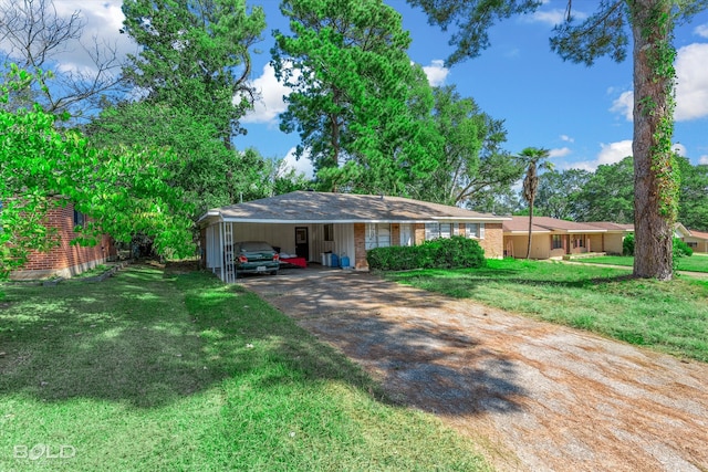 ranch-style house featuring a front yard and a carport