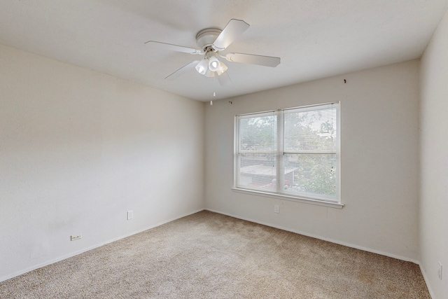 13818 Methuen Green Ln, Dallas, TX 75240 - spare room featuring ceiling fan, light carpet, and baseboards