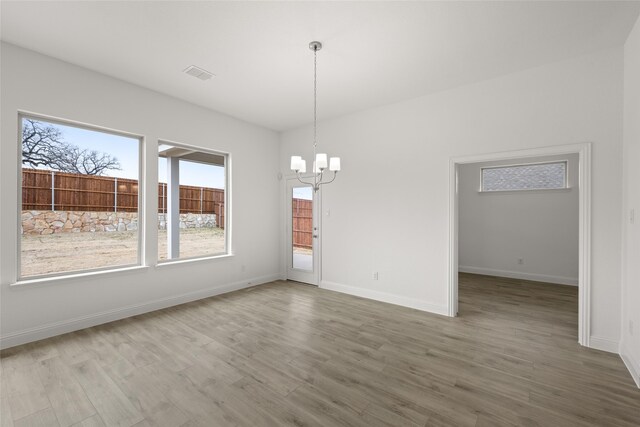 spare room with light hardwood / wood-style flooring, lofted ceiling, and ceiling fan