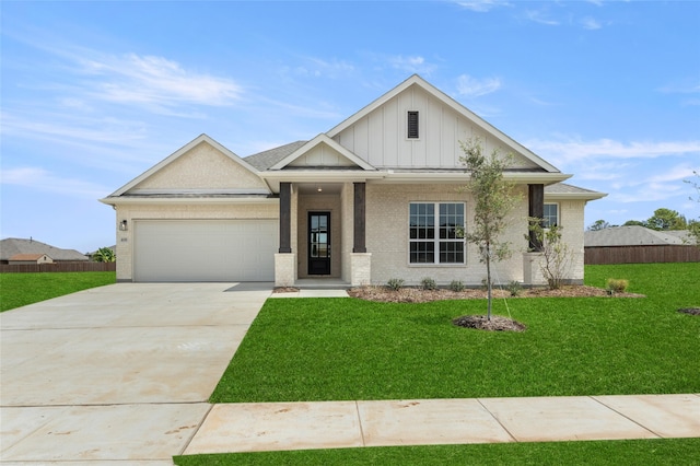 view of front of house featuring a front yard and a garage