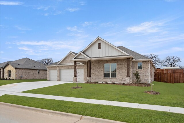 craftsman house with a garage and a front yard