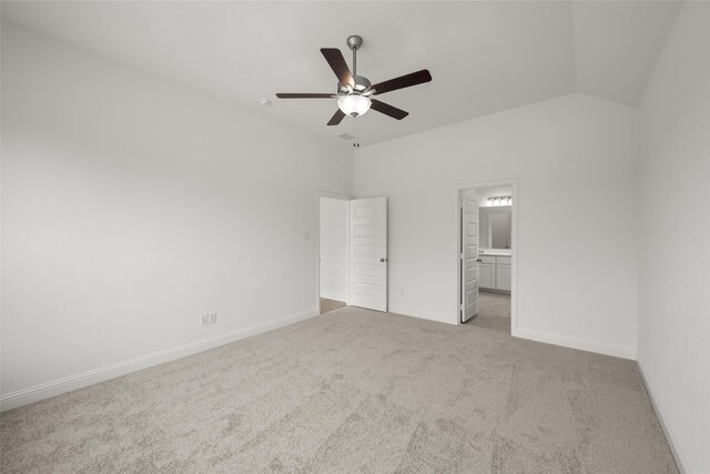 unfurnished room with lofted ceiling, carpet flooring, and ceiling fan