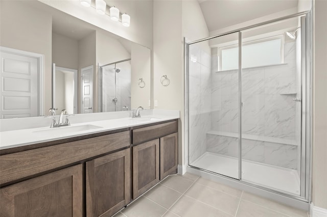 bathroom with vanity, walk in shower, and tile patterned flooring