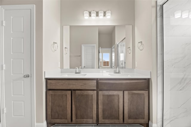 bathroom with vanity and a shower with shower door