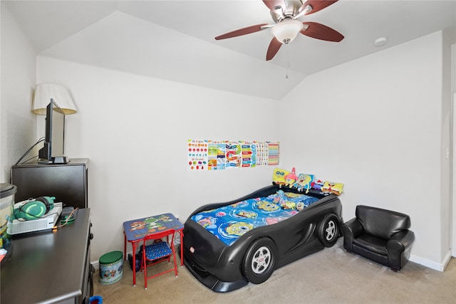 carpeted bedroom featuring lofted ceiling, a ceiling fan, and baseboards