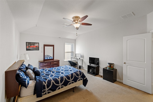 carpeted bedroom with visible vents, ceiling fan, baseboards, and lofted ceiling