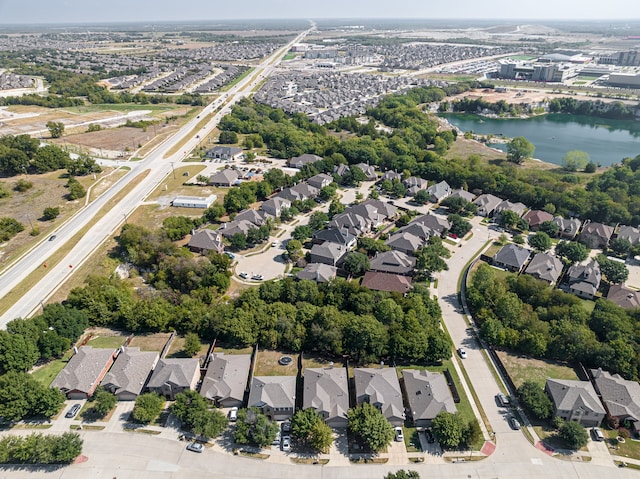 drone / aerial view with a residential view and a water view