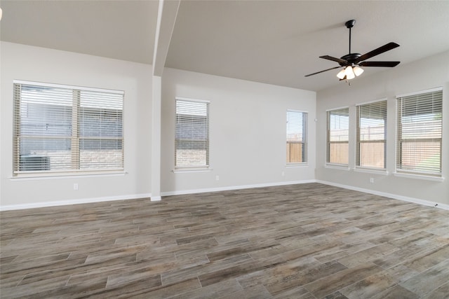 empty room with wood-type flooring and ceiling fan