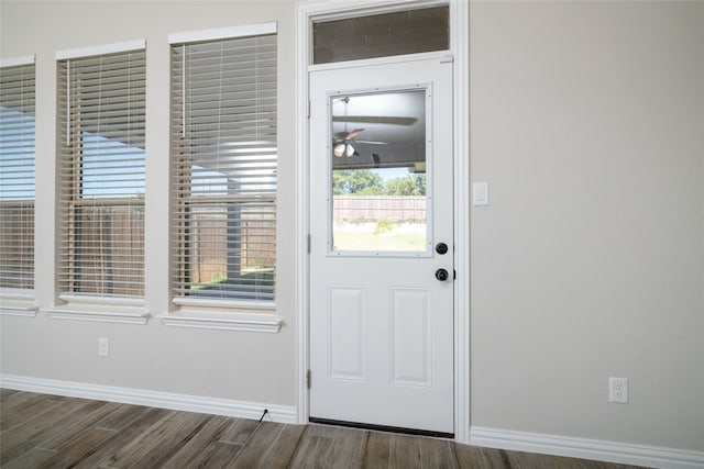 doorway to outside with dark hardwood / wood-style floors