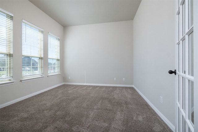 carpeted empty room with plenty of natural light