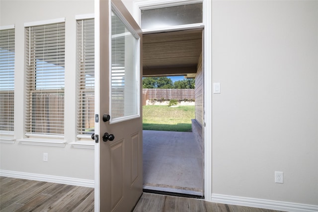 doorway to outside featuring hardwood / wood-style flooring