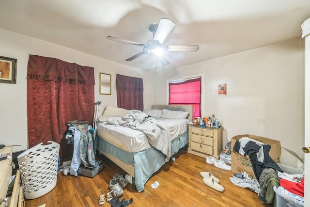 bedroom featuring wood finished floors and ceiling fan
