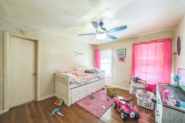 bedroom with ceiling fan and dark hardwood / wood-style floors