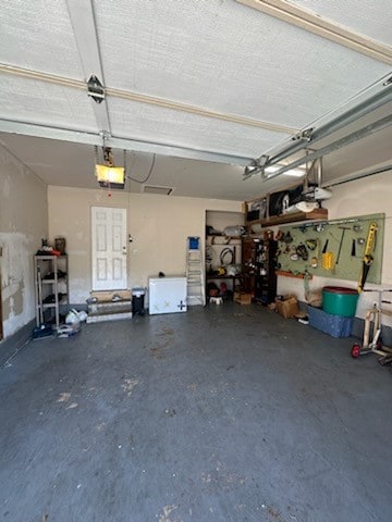 garage featuring a garage door opener