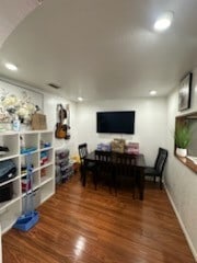 dining area with dark hardwood / wood-style floors