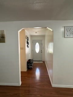 entryway with dark hardwood / wood-style floors