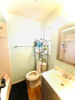 full bathroom with vanity, a textured ceiling, separate shower and tub, hardwood / wood-style flooring, and toilet