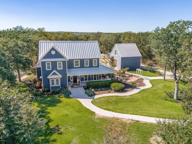 view of front of home featuring covered porch and a front yard