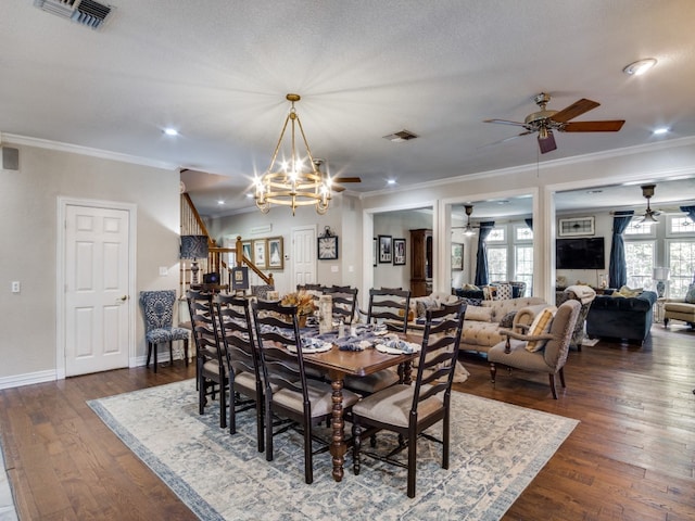 dining space with ornamental molding, a textured ceiling, ceiling fan with notable chandelier, and dark hardwood / wood-style flooring