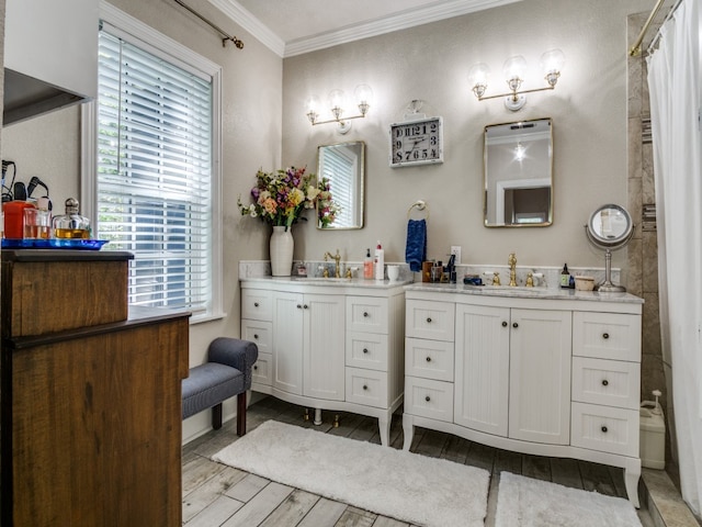 bathroom with a shower with curtain, hardwood / wood-style flooring, vanity, and crown molding