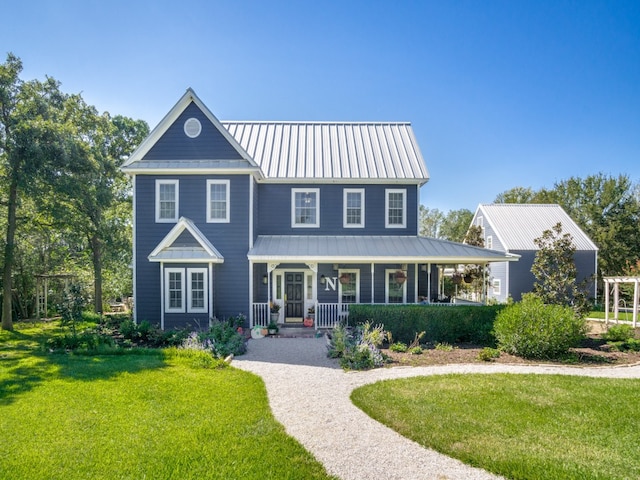 view of front of house with a porch and a front lawn