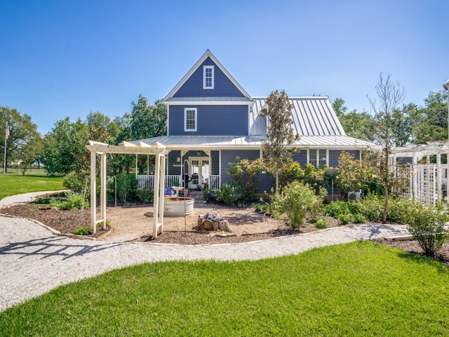 back of property with a pergola, a porch, and a lawn