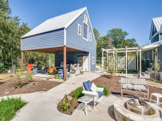 view of patio / terrace featuring a pergola and a fire pit