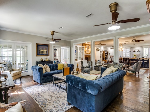 living room featuring ornamental molding, french doors, and dark hardwood / wood-style flooring