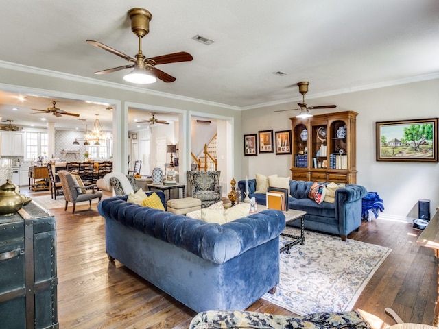 living room featuring crown molding and hardwood / wood-style floors