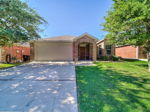 ranch-style home with a front yard and a garage