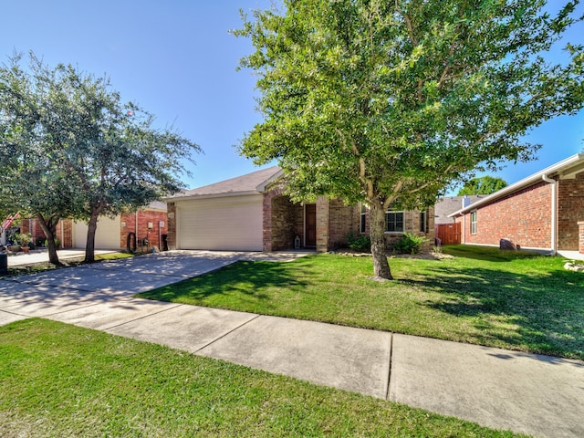 view of front of property featuring a garage and a front lawn